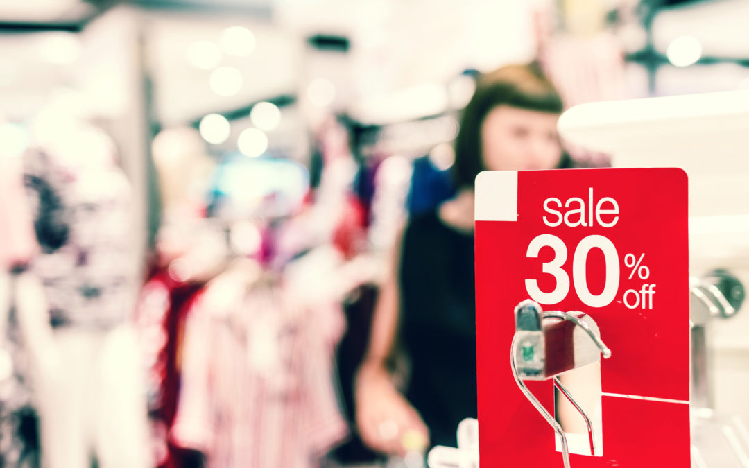 Promotional sale tag on the rack in a clothing store